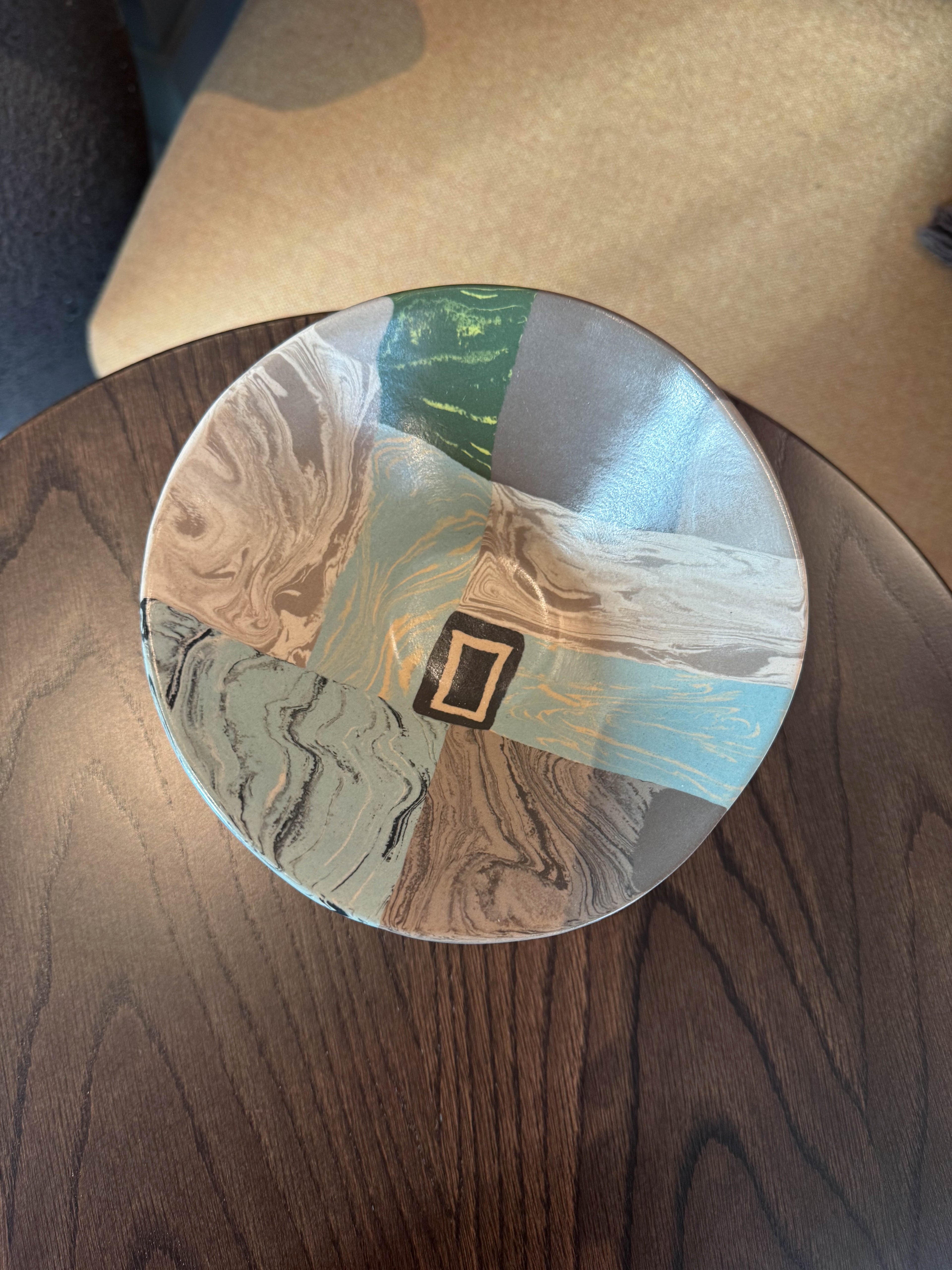 Ceramic flare bowl with segmented marbled forms and geometric detail