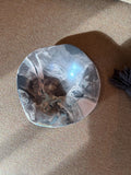 Ceramic plate with flowing marbled glaze in soft grey tones